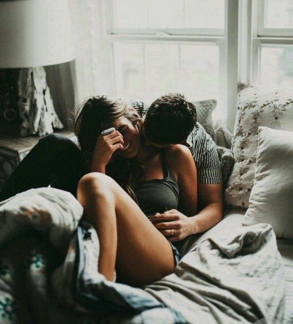 By hands in bed