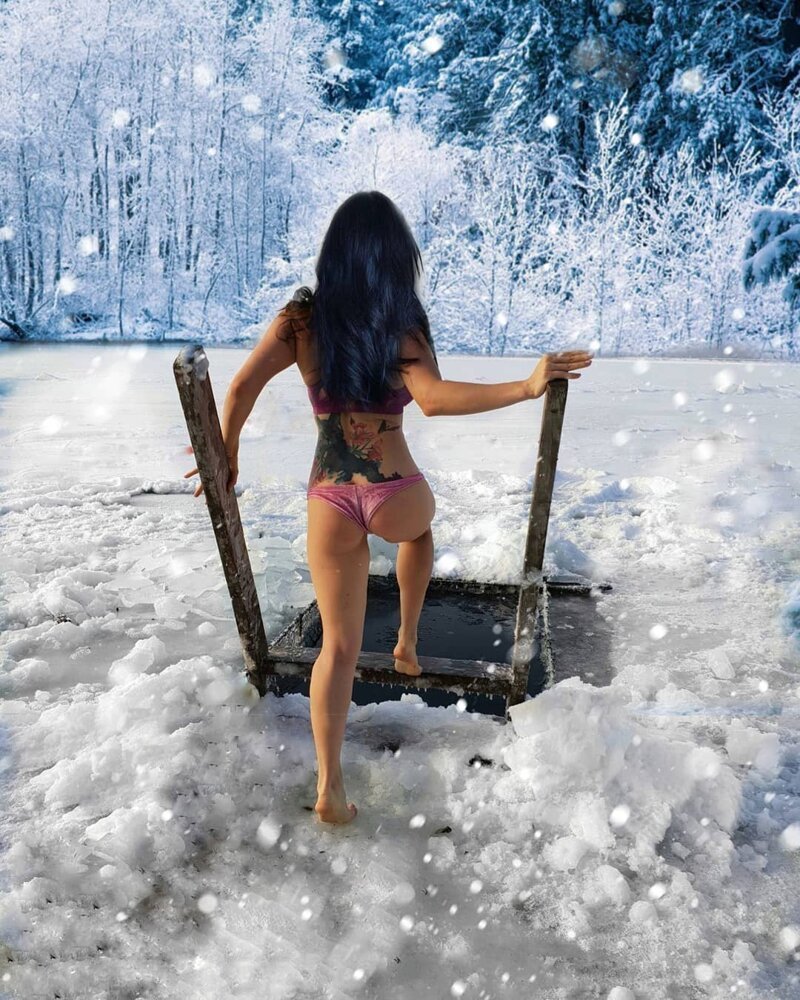 Girl in the snow in a swimsuit
