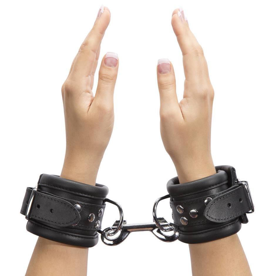 Girl in leather handcuffs