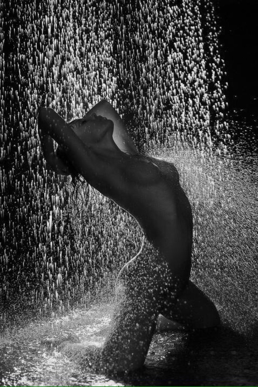 Naked blonde in the rain