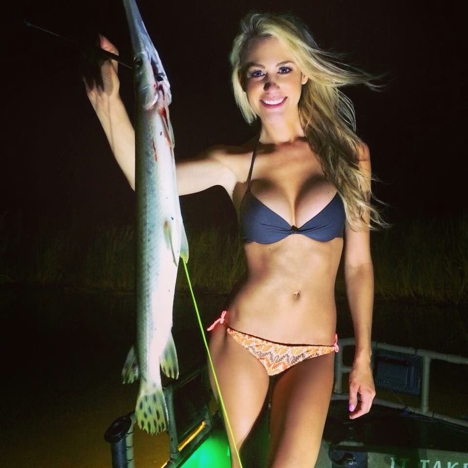 Girls in a bikini with a fishing rod