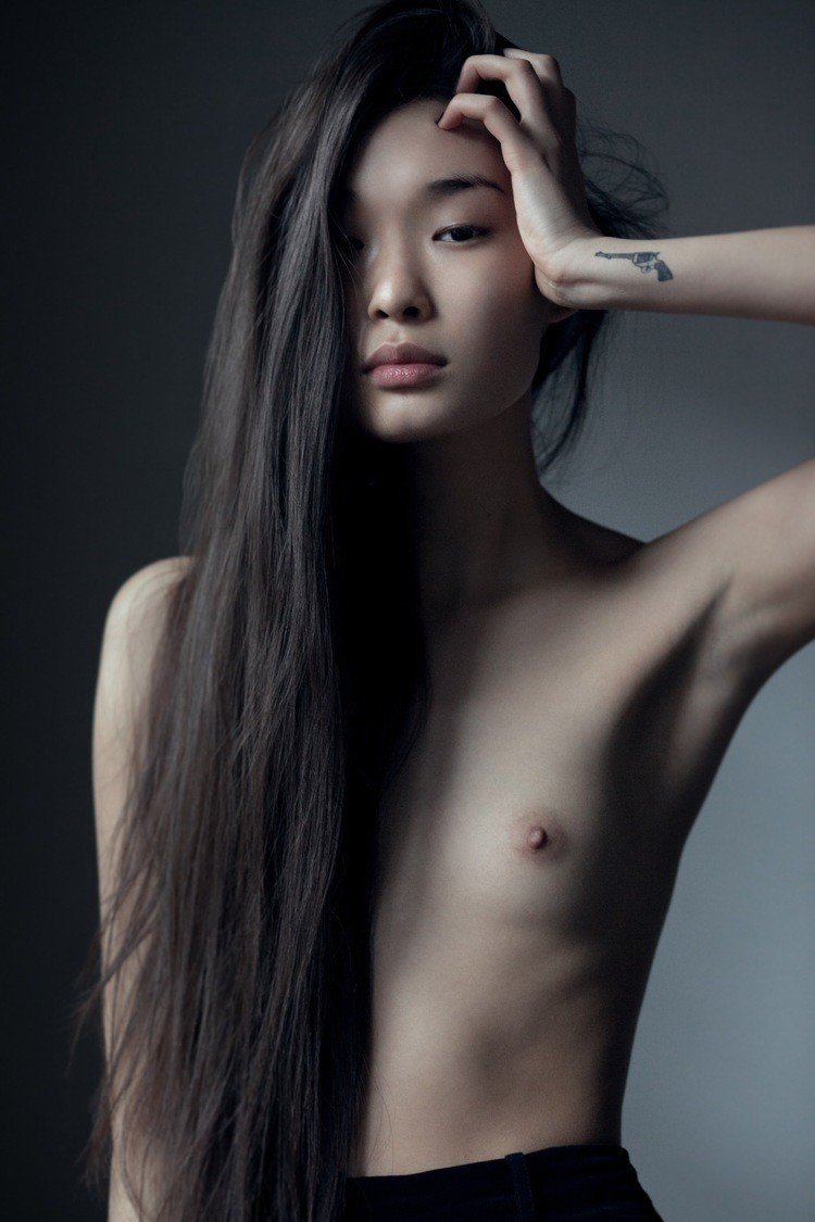 A thin Asian naked