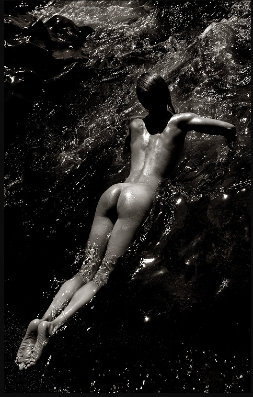 The girl undressed by the water