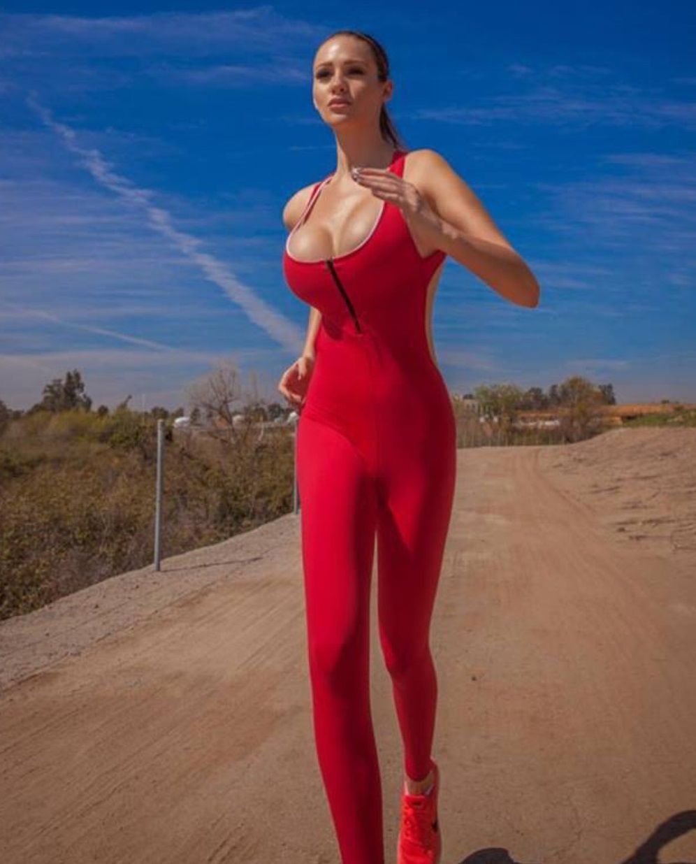 Alina Lewis in a dress
