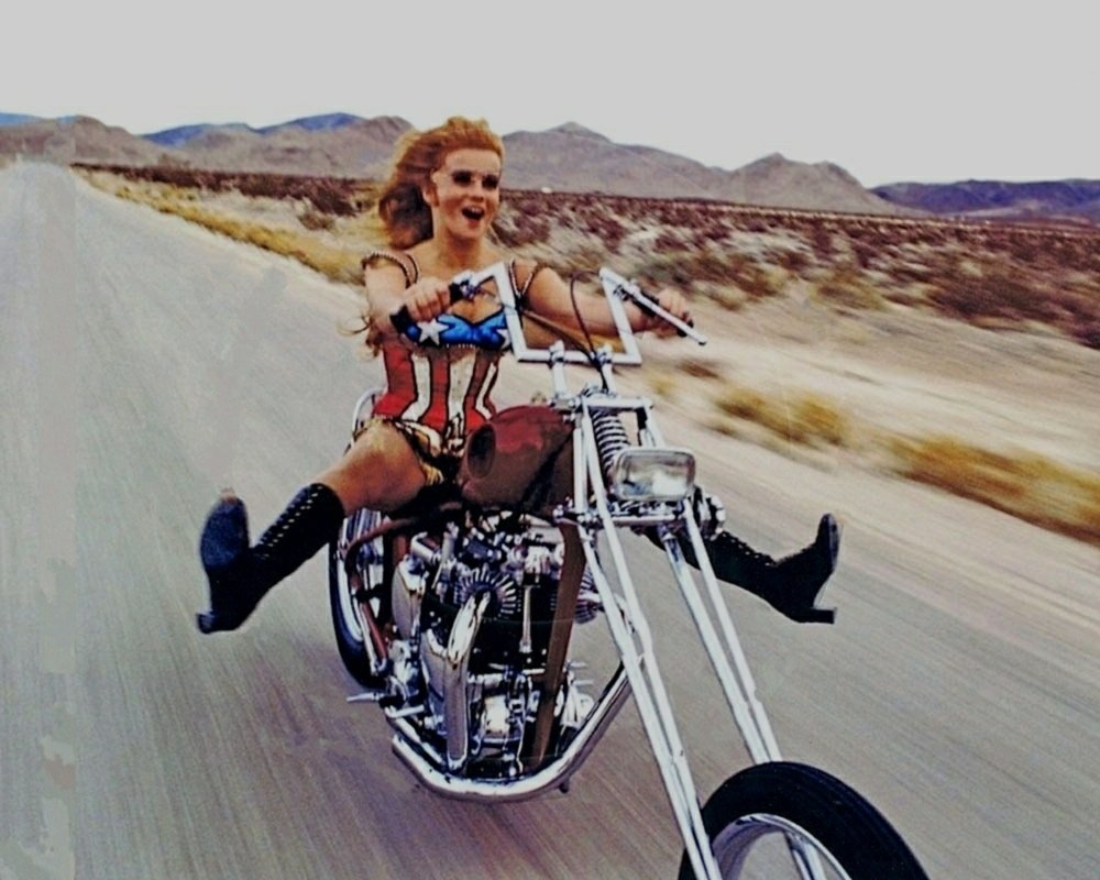 Anne Margaret on a motorcycle