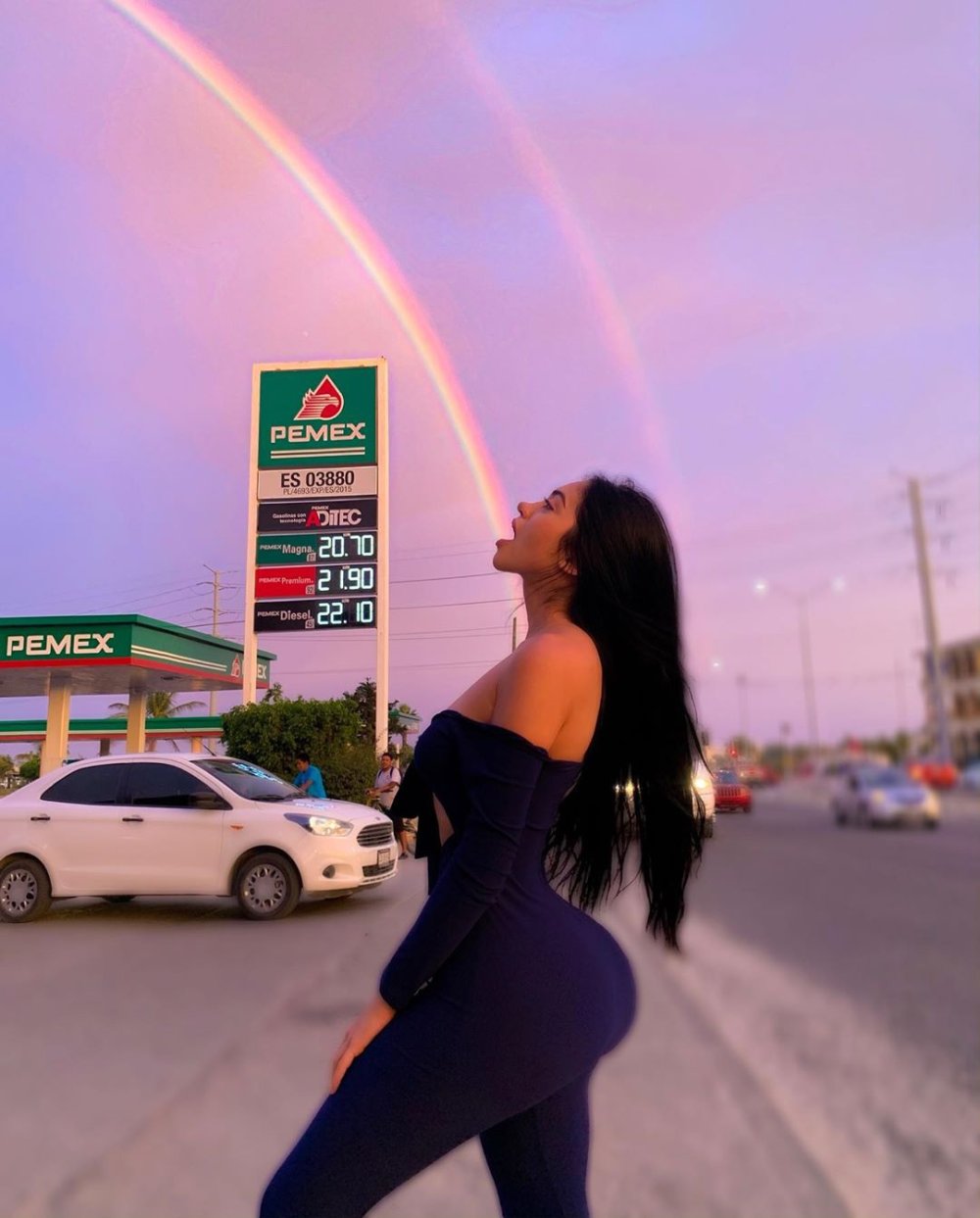 Jailyne OJeda near the car