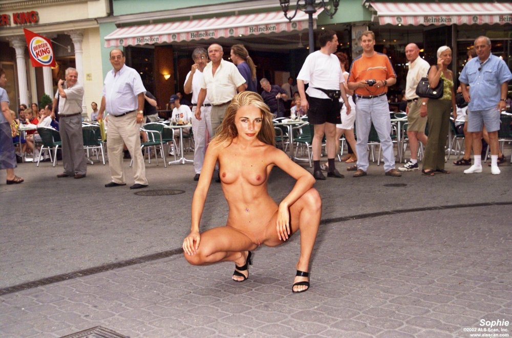 Woman undresses on the street