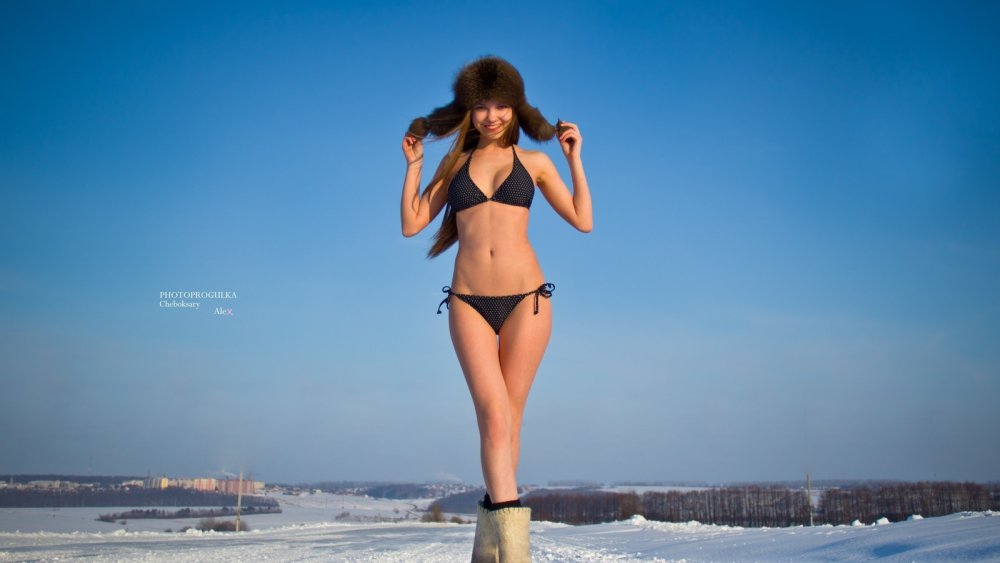 Girl in the snow in a swimsuit