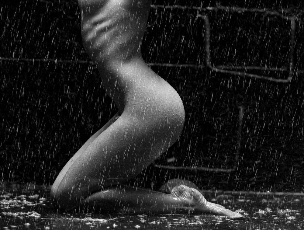 Naked women in the rain