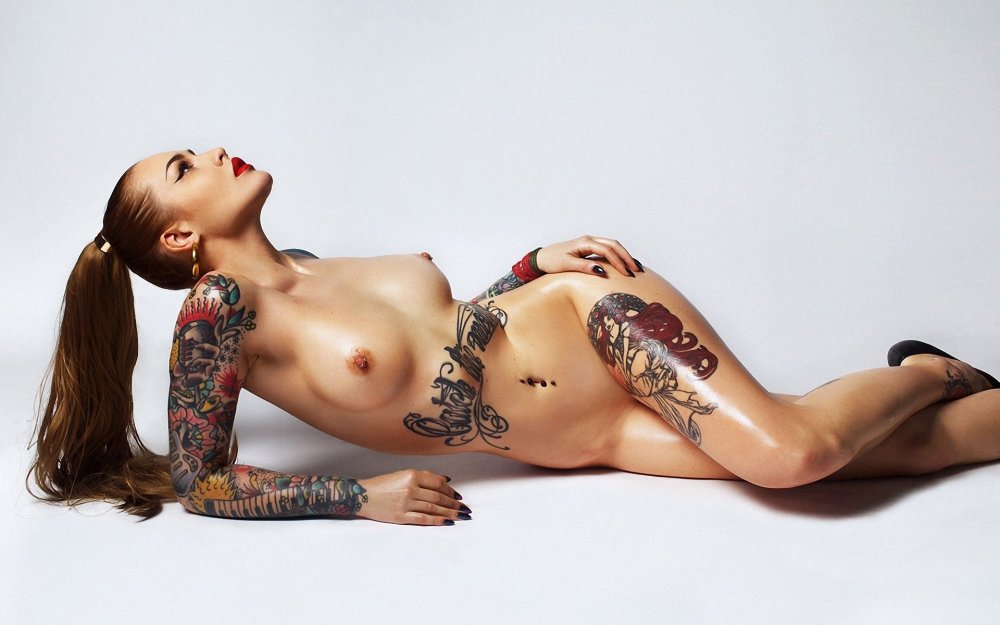 Tattoo on naked female breast