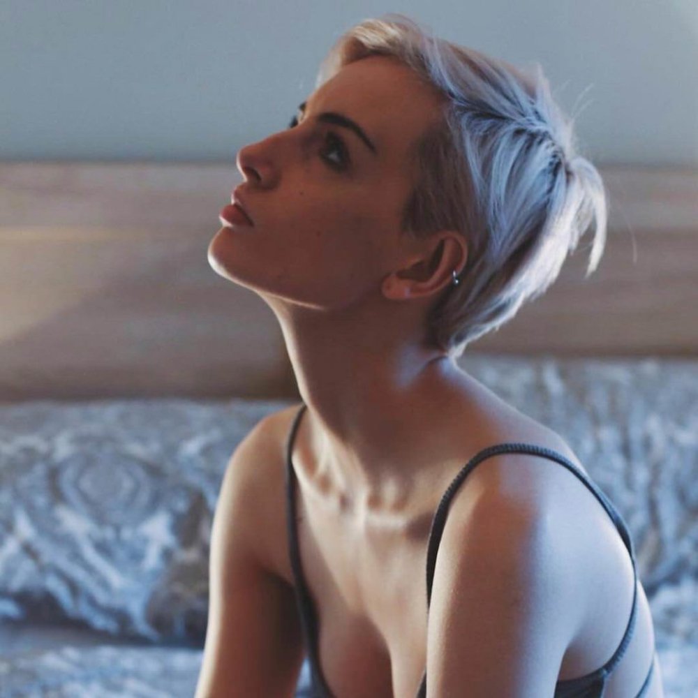 Naked blonde with a short haircut