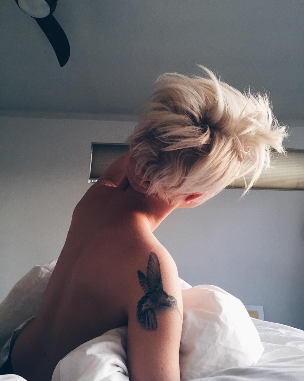 Naked blonde with a short haircut