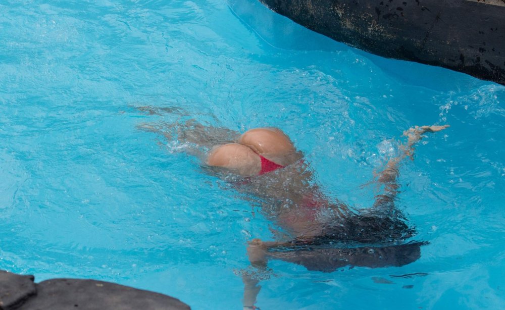 Naked women with flippers underwater