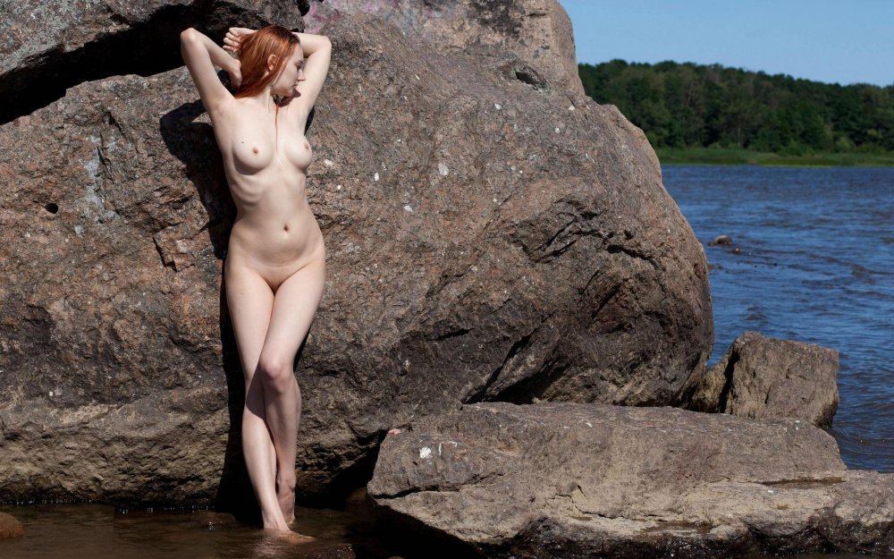 Naked women near the rock horizontal