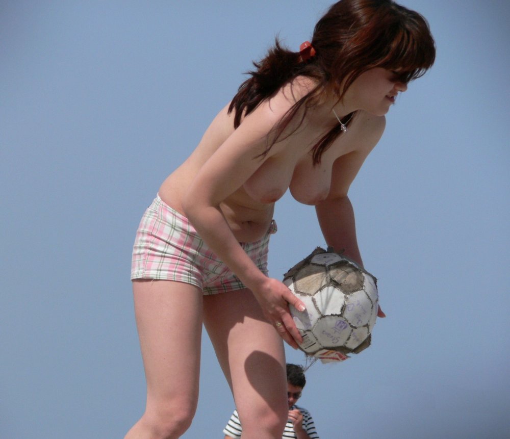 Naked beach volleyball players