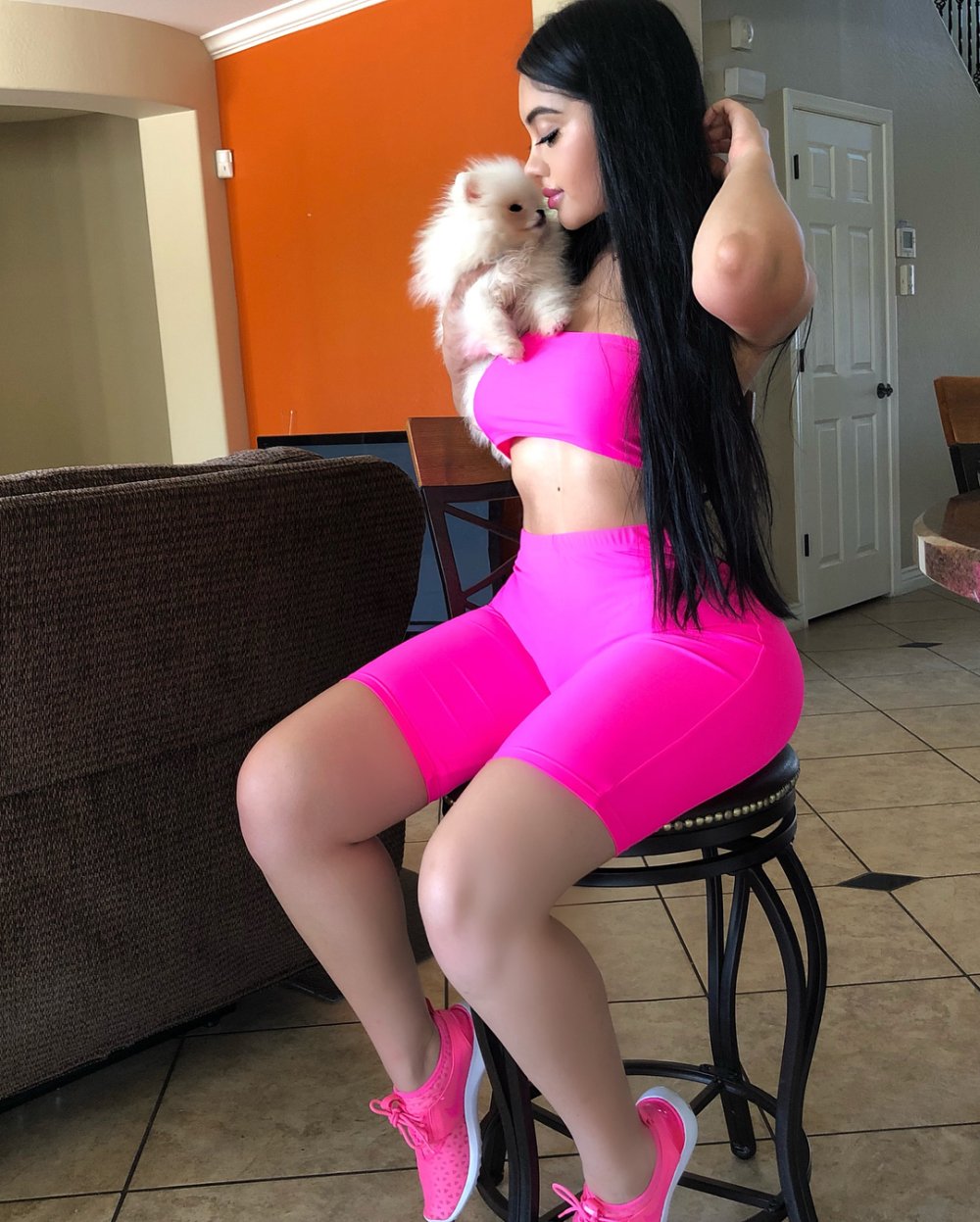 Jailyne OJeda near the car