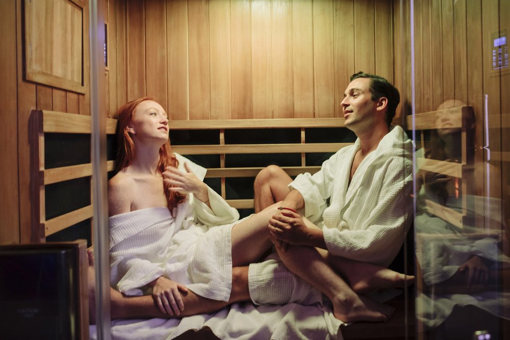 Girl in a bathhouse with a broom