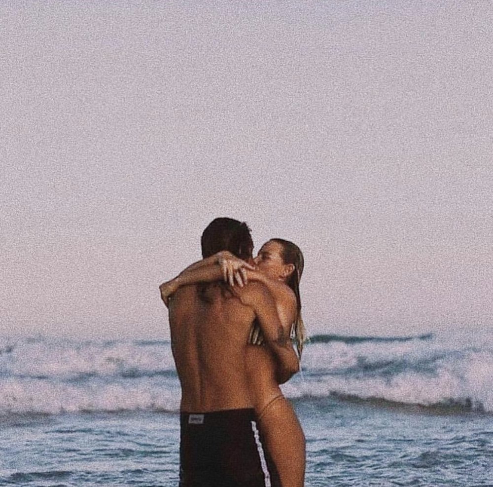 A guy with a girl at sea