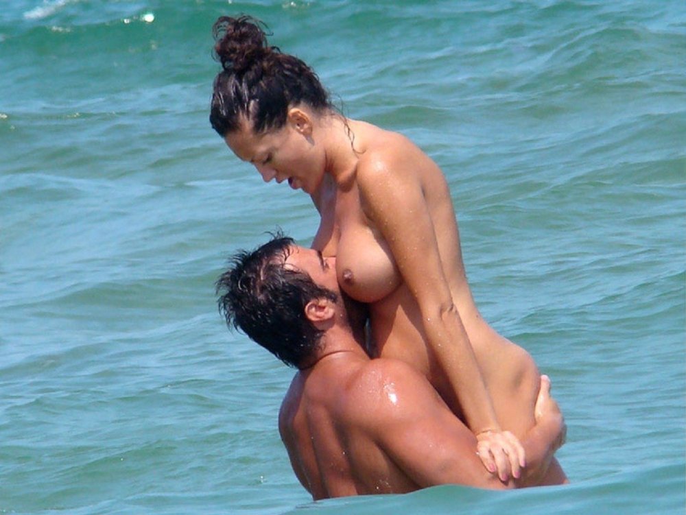 Naked man and woman at sea