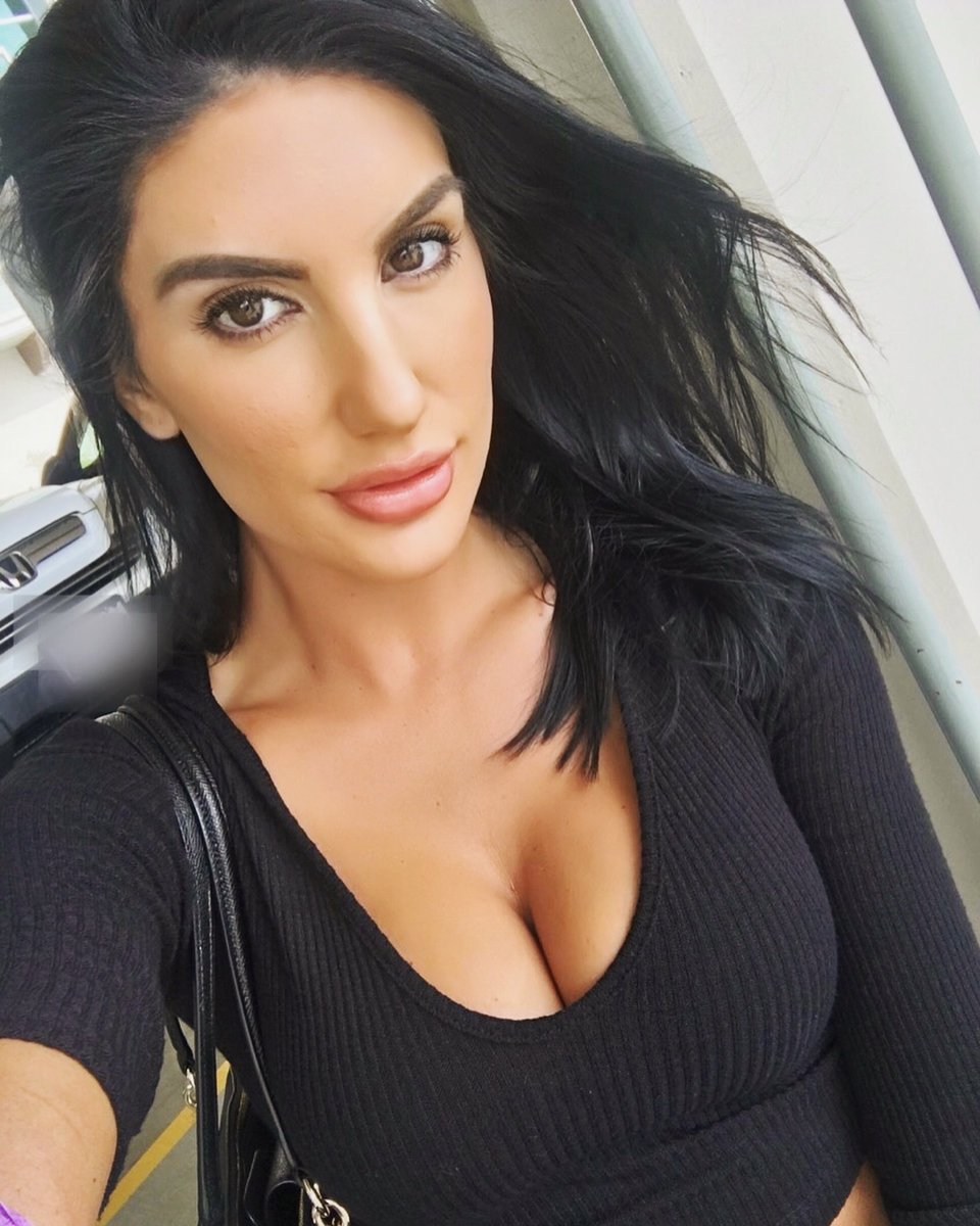 Nicole Zhoston in a black dress