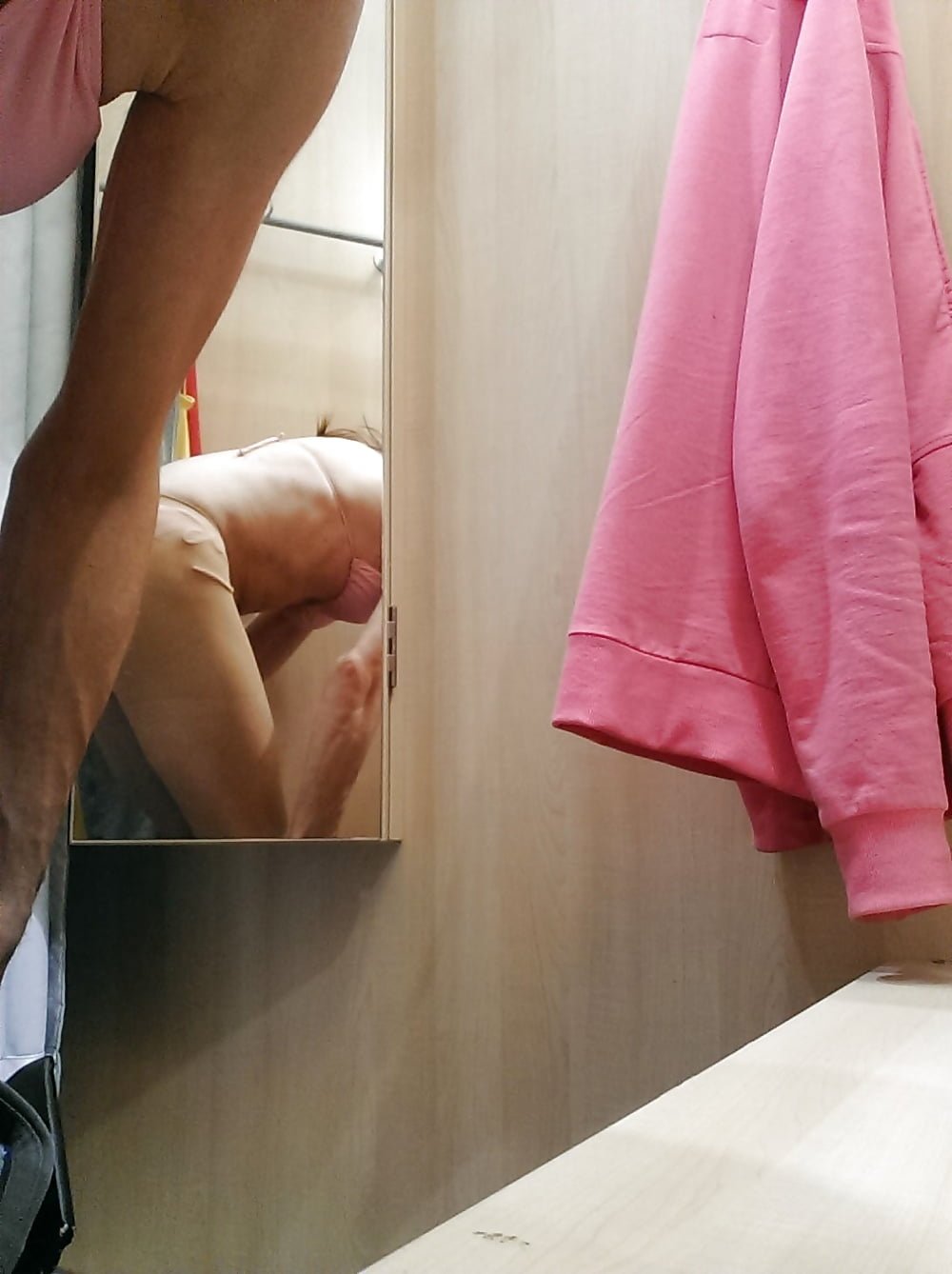 Naked women in fitting rooms