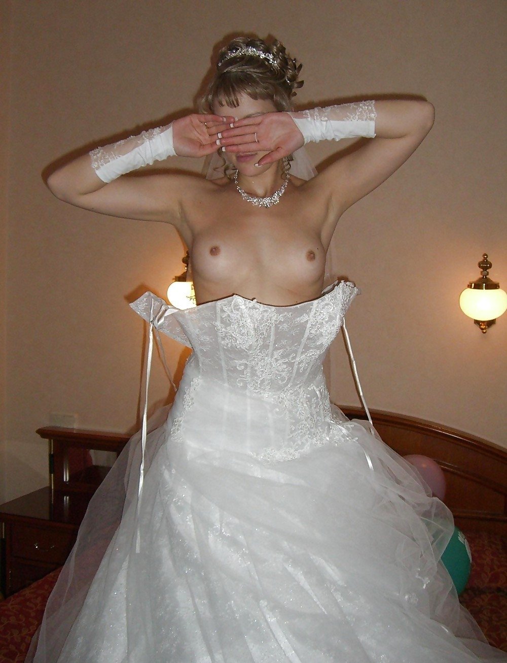 Naked wife in a wedding dress