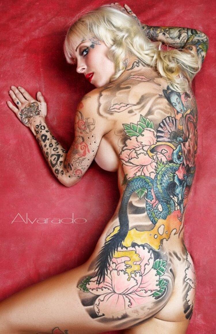 Naked female body in tattoos