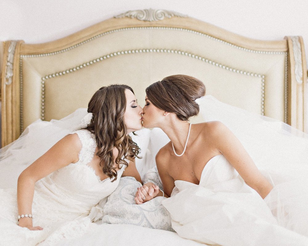 Girlfriends in wedding dresses