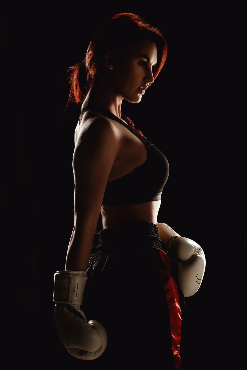 Girl in red boxing gloves ring