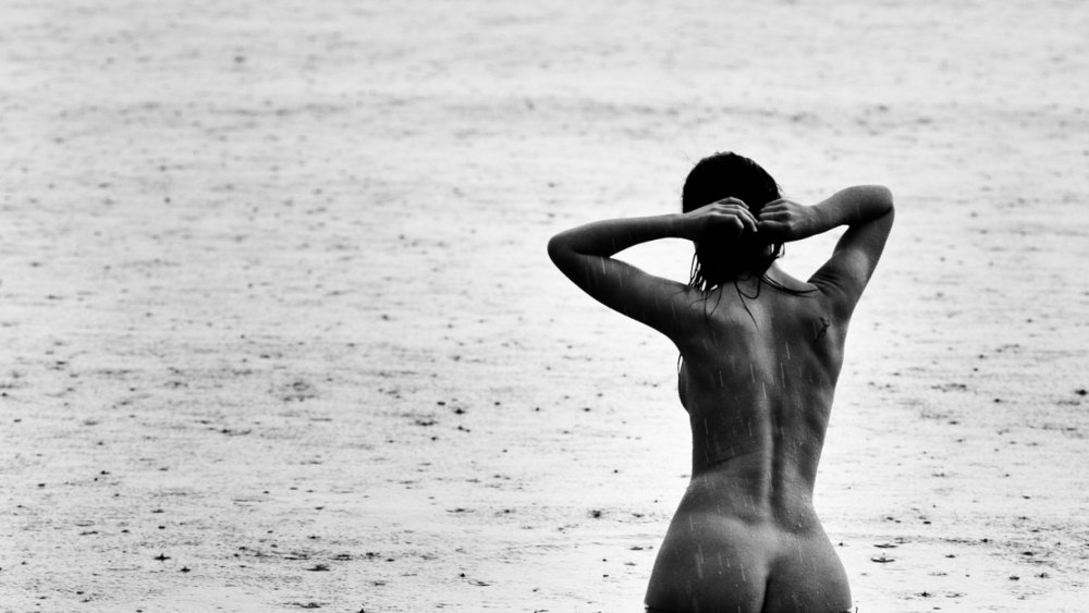 Naked women in the rain
