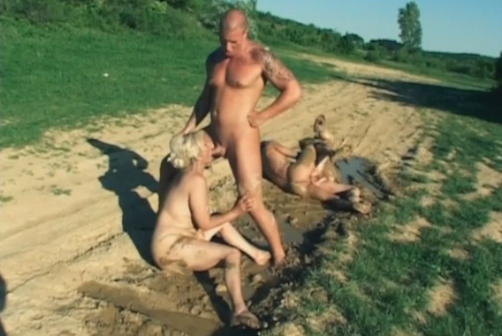 Naked women bathe in the mud