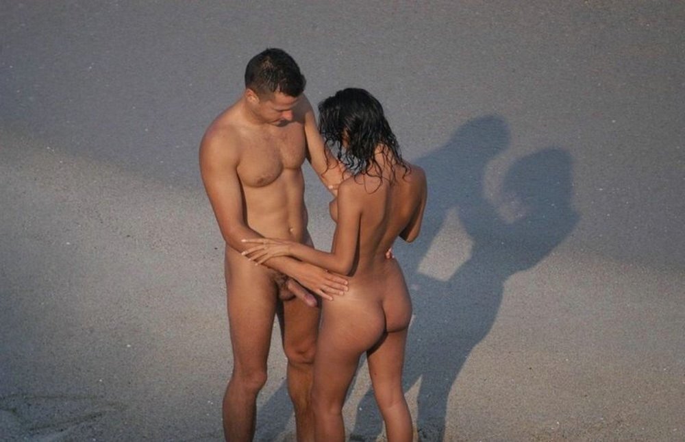 Naked girls with guys on the beach