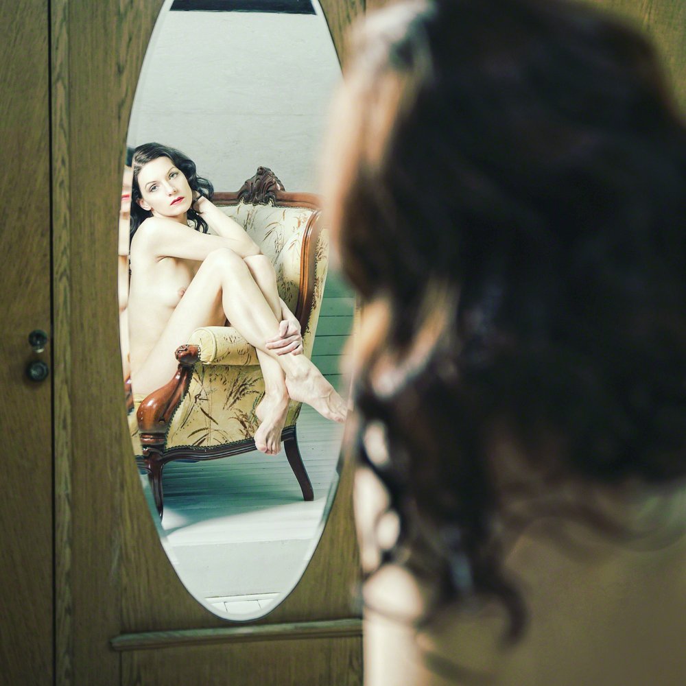 Erotic photo shoot with a mirror