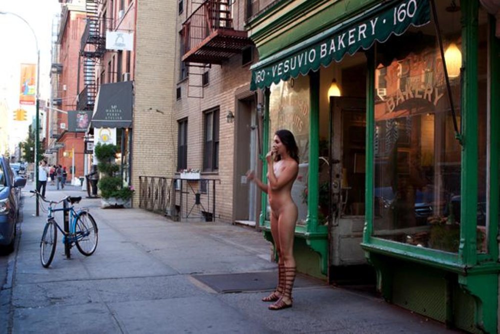 The girl undresses in public