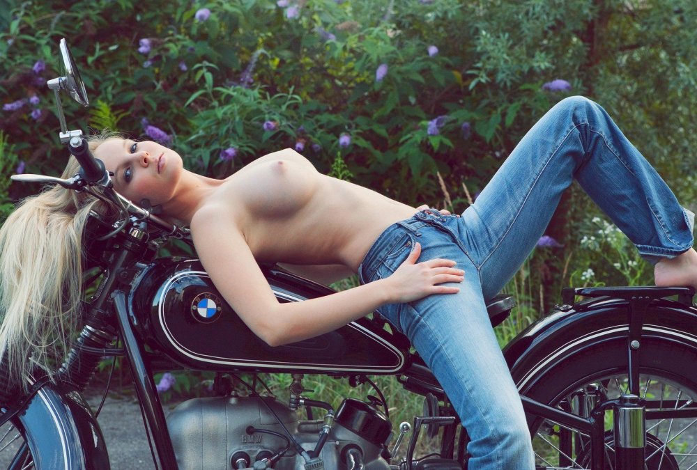 Naked lesbian beauties on a motorcycle