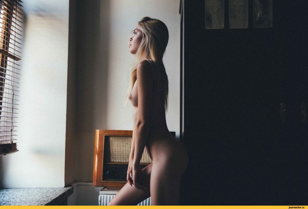 Naked beautiful milf with a book wallpaper