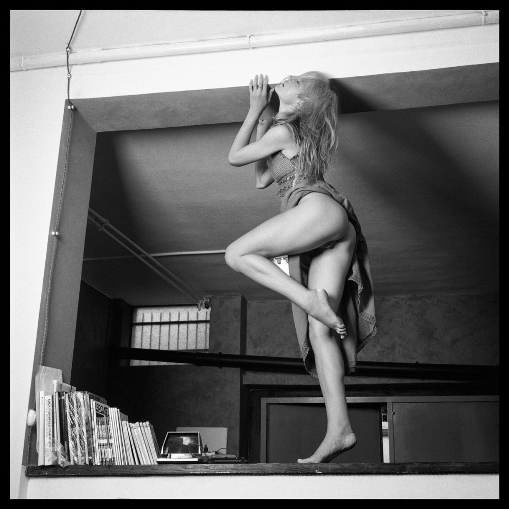 Naked woman in the window opposite