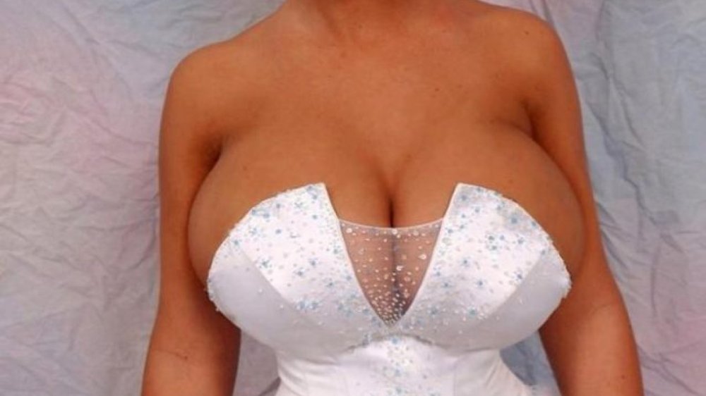 Breasts falling out of a wedding dress