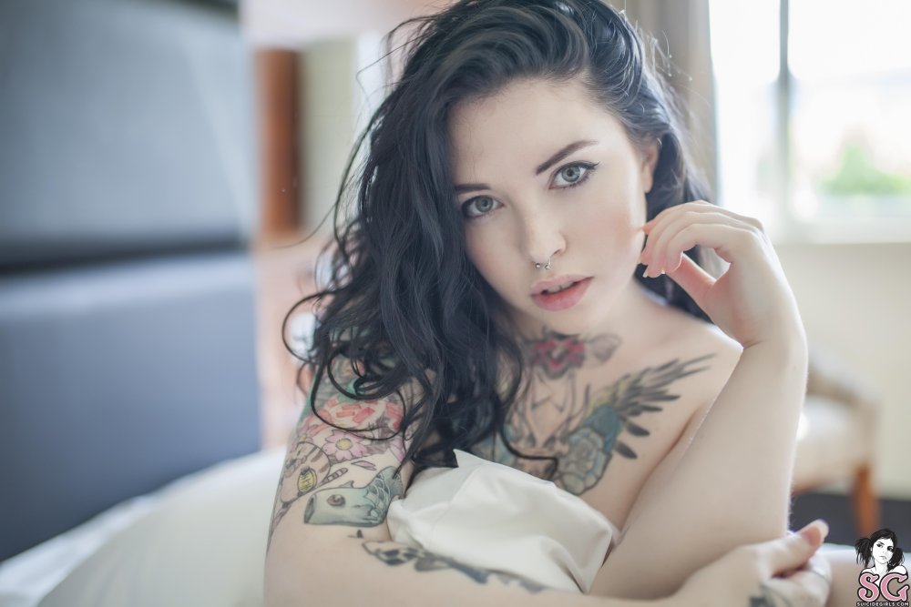 Women with short hair and nude tattoos