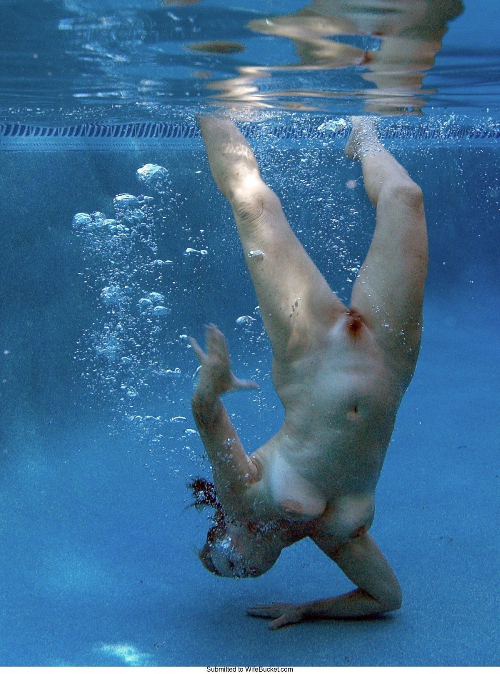 Naked beauties underwater