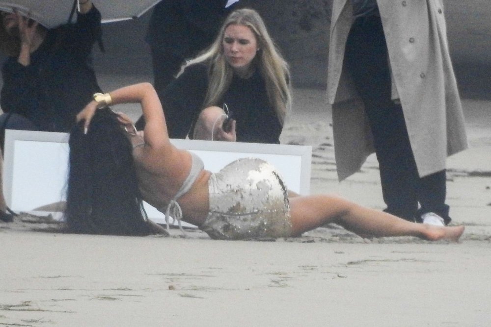 Photo by Kylie Jenner in a black swimsuit lying on his back