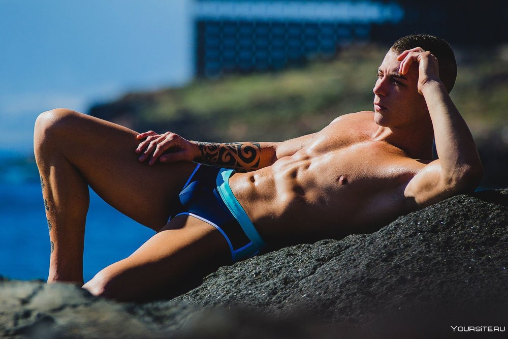 Beautiful men in swimming trunks