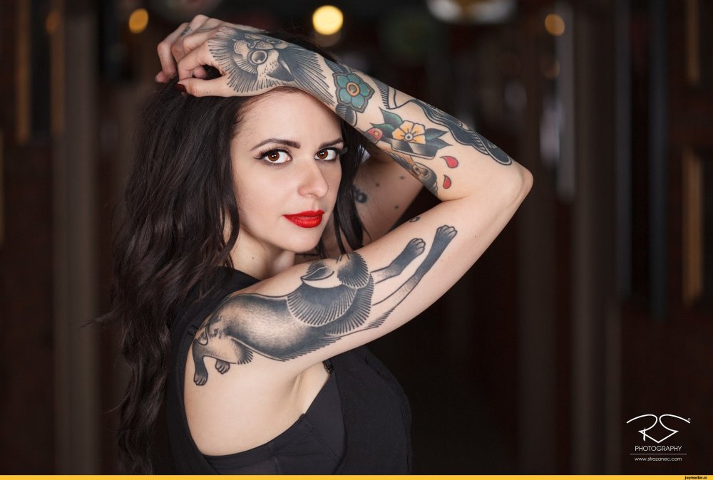 Model with tattoo stars on nipples