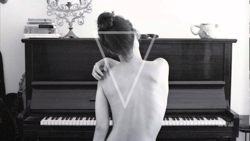 Girl for the piano from the back