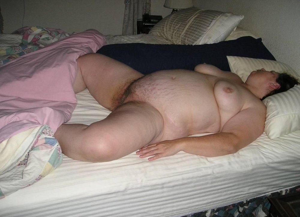 Large naked women in bed