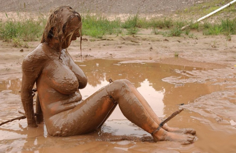 Naked beauties in mud