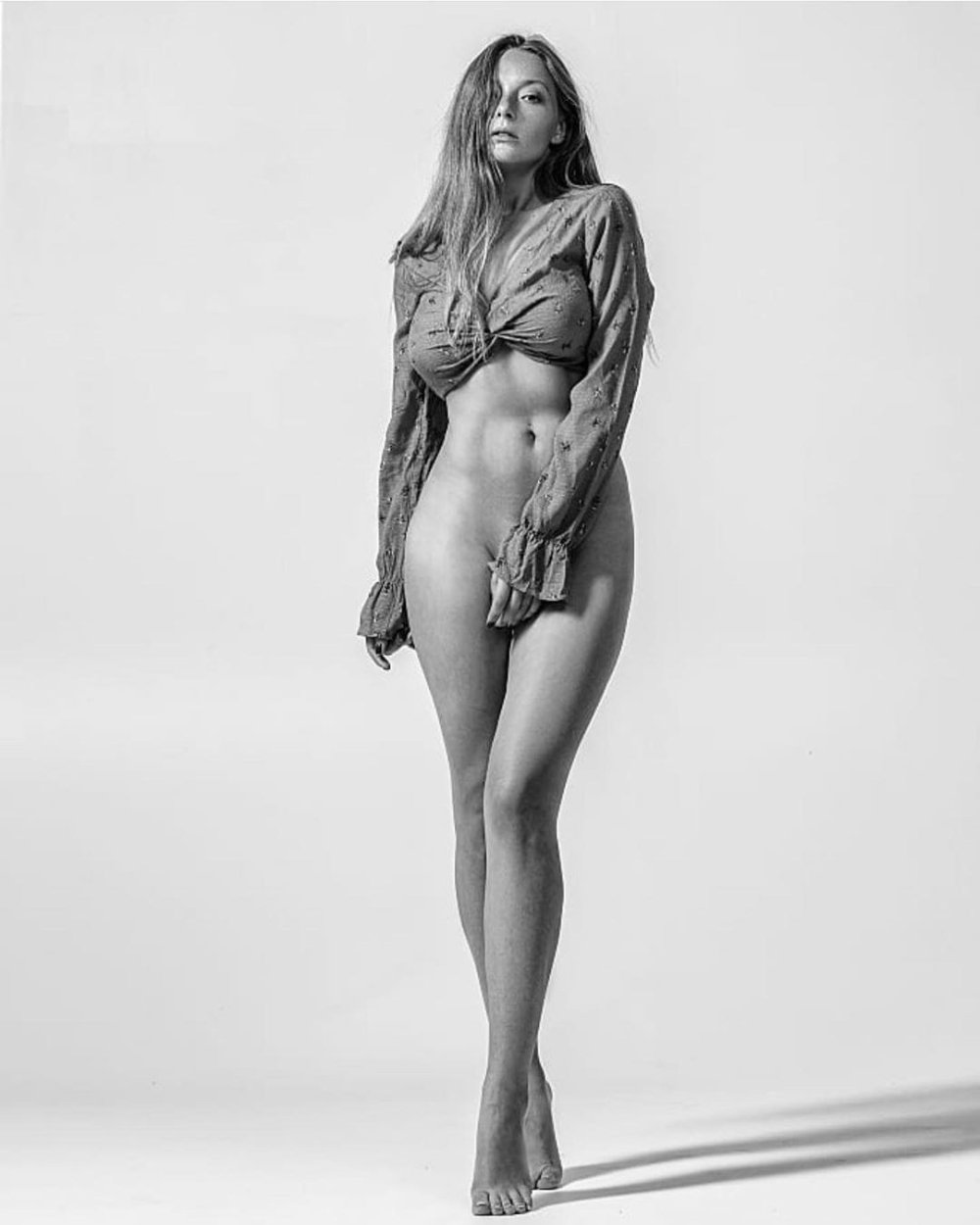 The wife poses naked in the forest