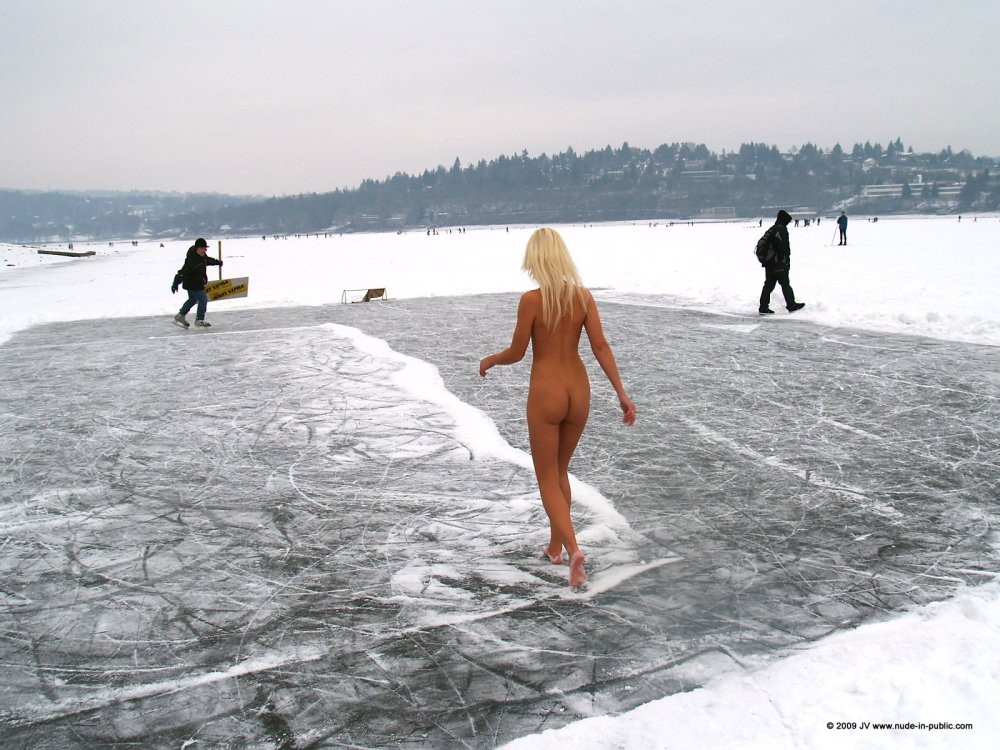 The girl undresses in the winter
