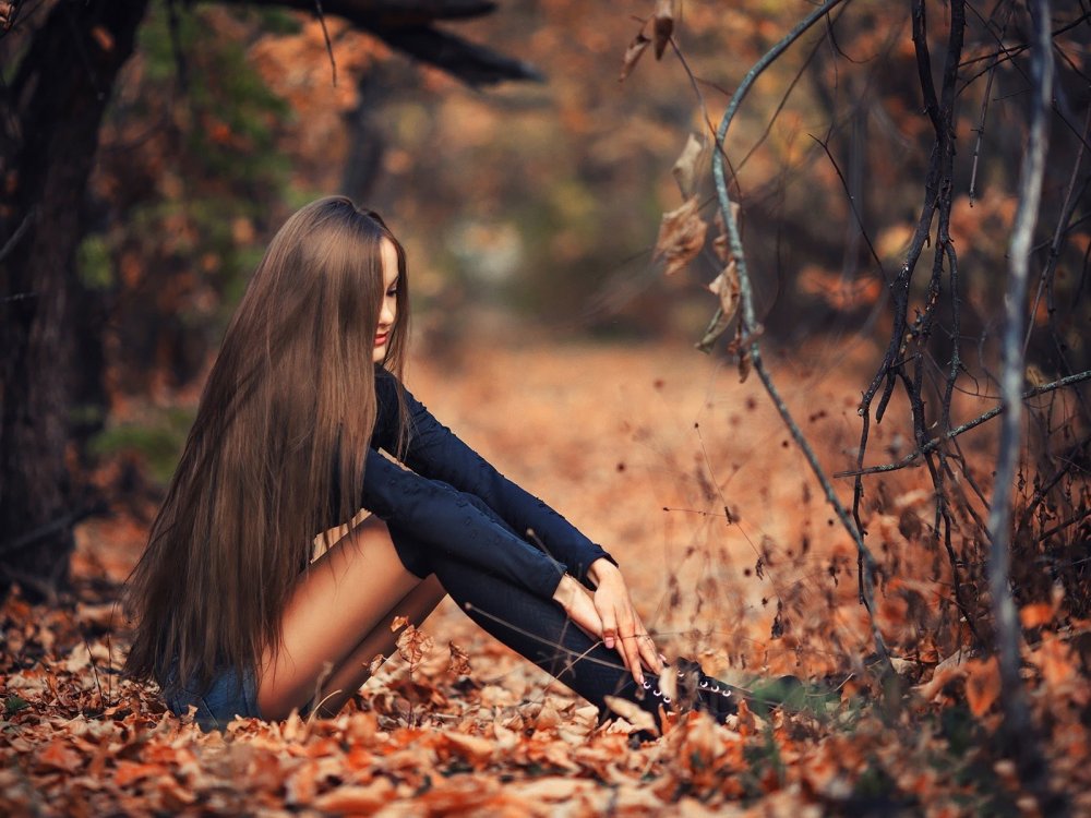 Girl in the autumn forest