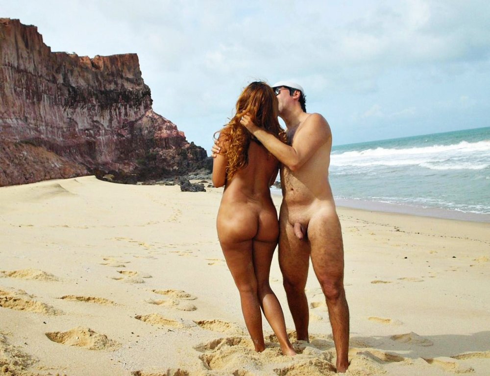 Naked men and women on the beach